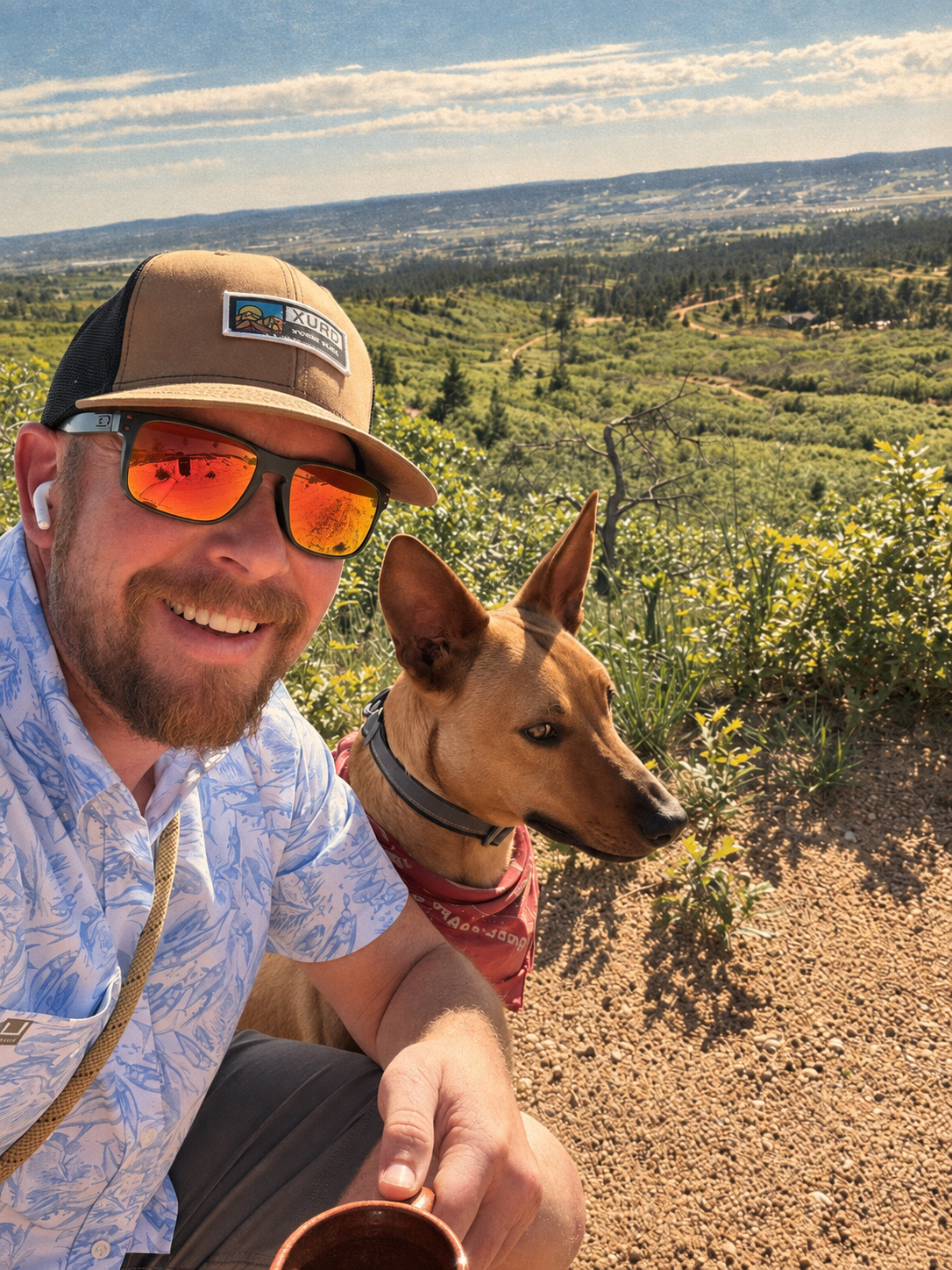 Kyle and Sur sharing a trail break with a mug of coffee.